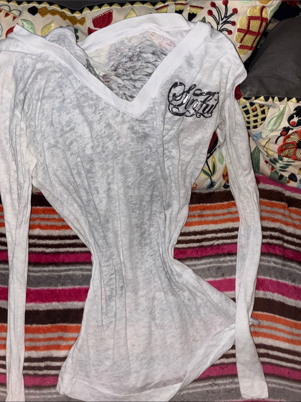 Sinful long sleeve sheer top with wing design on back